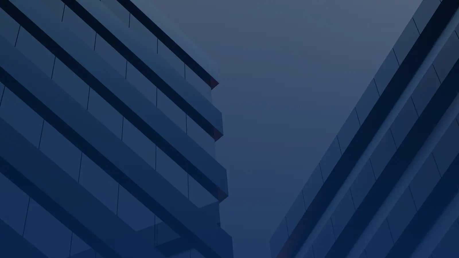 Glass office towers in a blue haze