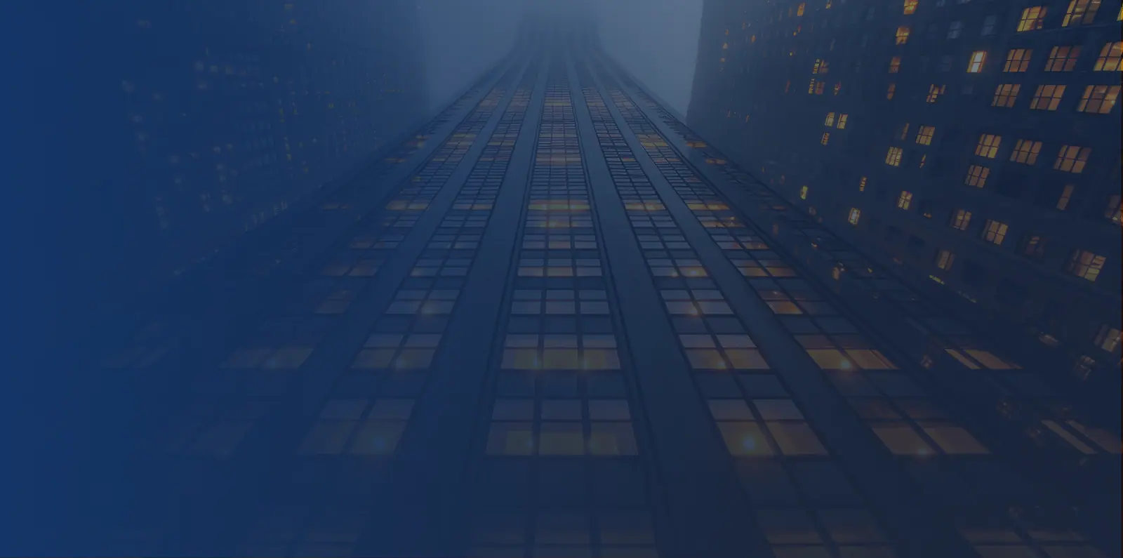 Looking up at a Los Angeles office tower at dusk